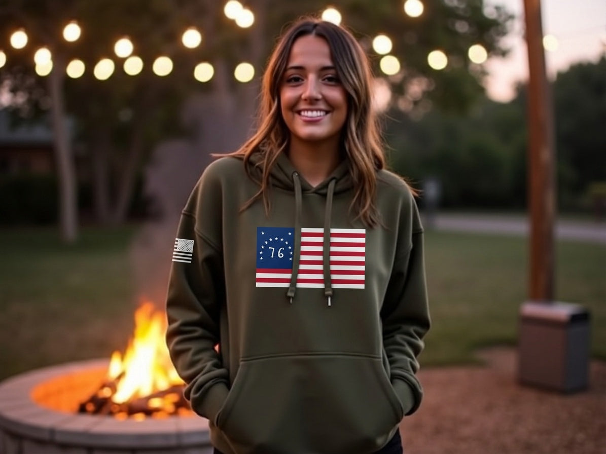 Woman wearing Gun Beaver Bennington Flag hoodie by a fire pit